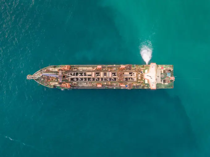 Aerial view of sand dredging boat in Persian Gulf, Dubai, UAE.