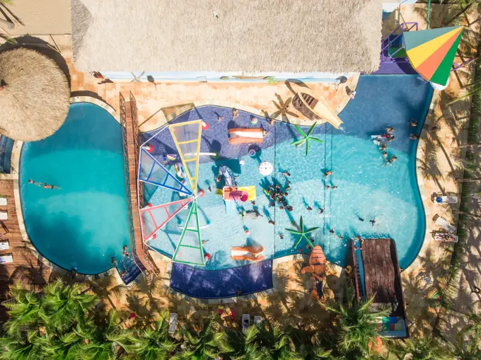 FORTALEZA, BRAZIL - 29 July 2016 : Aerial view of people swimming in swimming pool close to the beach in Brazil.