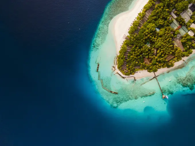 Aerial view of tropical island close up of beach and ocean, Baa Atoll, Maldives.