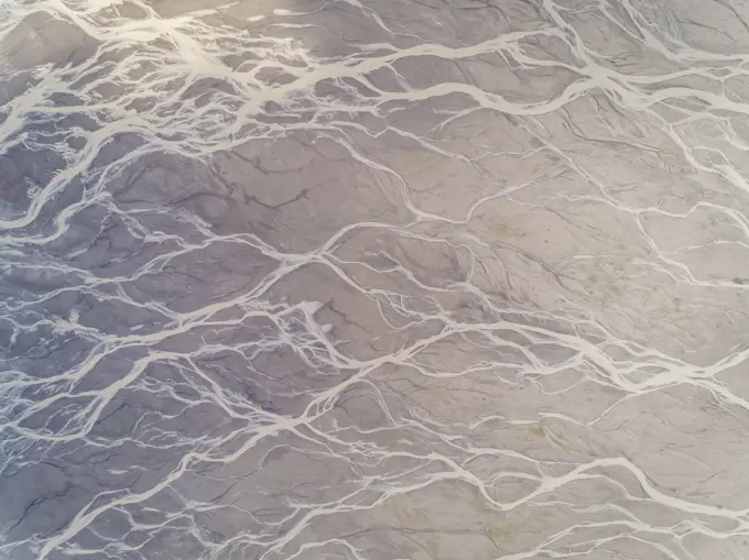 Aerial view above river creating an abstract pattern, Kachemak bay, Alaska.