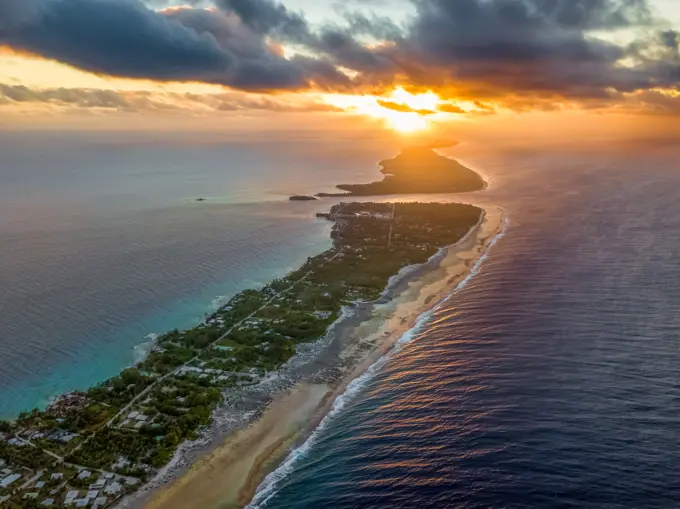 Aerial view of one of the largest atolls in the world, Rangiroa atoll at sunset in Tahiti.