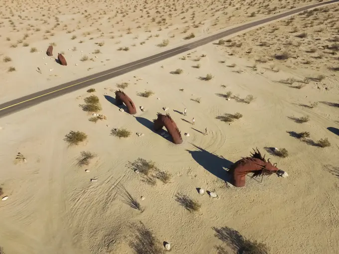 Aerial view of friends at Dragon sculpture in californian desert in Borrego Springs, USA.