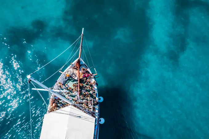 Tisno, Croatia - 9AUGUST 2019: Aerial view of a boat in the turquoise waters