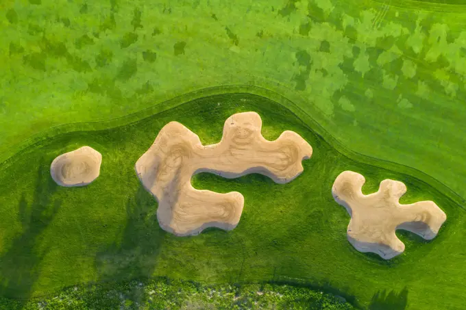 Aerial view of a golf course fairway and sand traps in early spring creating an abstract looking perspective at the Cantigny Golf Course in Wheaton, IL - USA