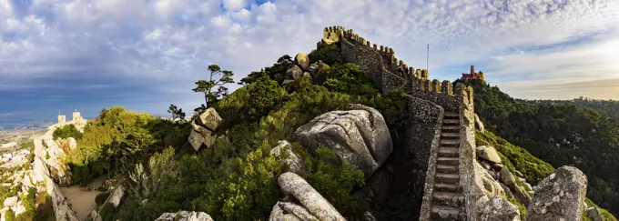 Panoramic view of the Moorish Castle (Castelo dos Morros), with Palace of Pena in the distance, Sintra, Portugal.