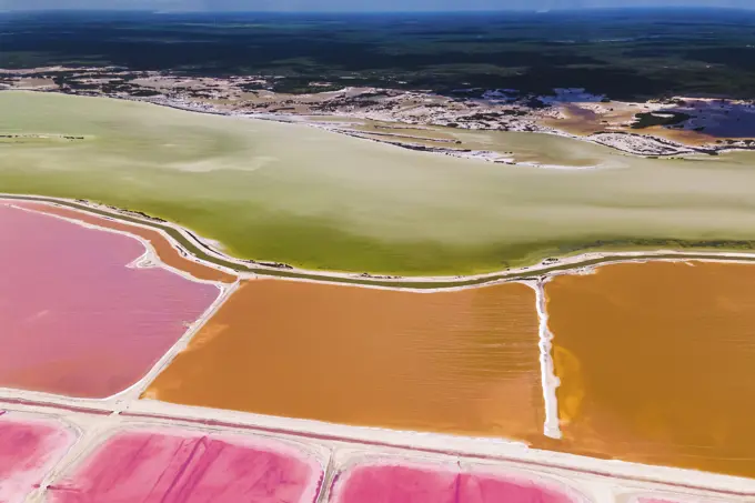 Aerial view of pink salt lakes along the coast at Ria Largatos Natural Park, Río Lagartos, Yucatan, Mexico.