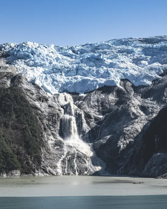 View of the mountain peaks with snow along the fjords in Antarctic region of Chile, Patagonia, Chile.