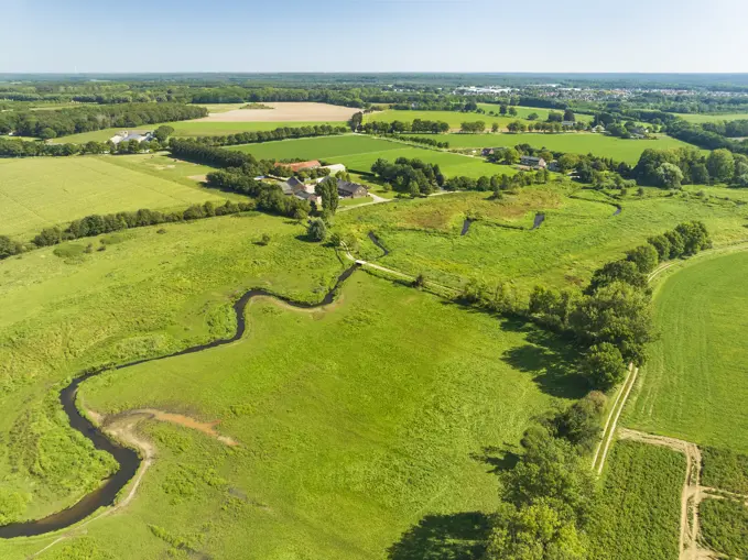 Aerial view of small meandering river Swalm in stream valley Swalmdal, Swalmen, Limburg, Netherlands.