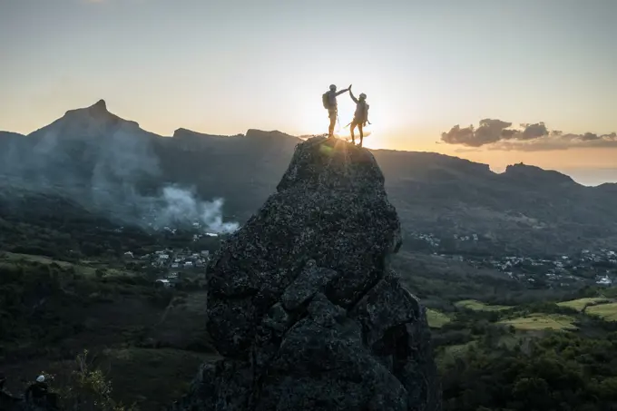 Aerial view of people climbing on Piton Jacob Peak mountain in Port Louis, Mauritius.