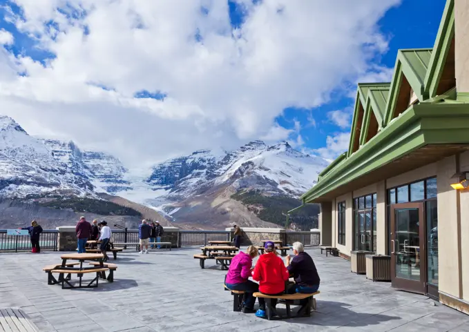 People sat outside the Columbia Icefield Interpretive Centre on the Icefields Parkway Jasper National Park Alberta Canada