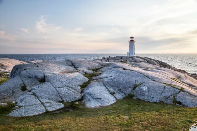A rocky outcrop and a landmark lighthouse in Peggy's Cove, Nova Scotia, Canada