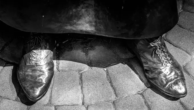 Fancy laced up shoes of statue by Emily Carr in Victoria, Vancouver Island Canada. No people.