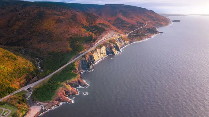 Stunning Aerial views of Cabot Trail over looking Cap Rouge, Cape Breton Highlands in the peak autumn fall season with mixed color deciduous trees.