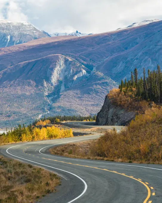 The remarkable, stunning, autumn, fall landscape of Yukon Territory in Northern Canada. Highway, road trip shot with mountain views.