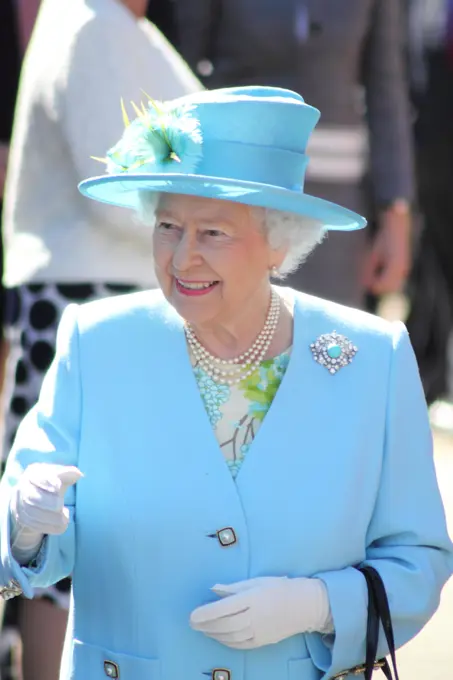 Matlock, Derbyshire, UK. 10th July 2014.  Queen Elizabeth II and the Duke of Edinburgh are received by Mr. William Tucker, Lord-Lieutenant of Derbyshire on arrival at Matlock Station ahead of a visit to luxury knitwear manufacturer, John Smedley and Chatsworth House.