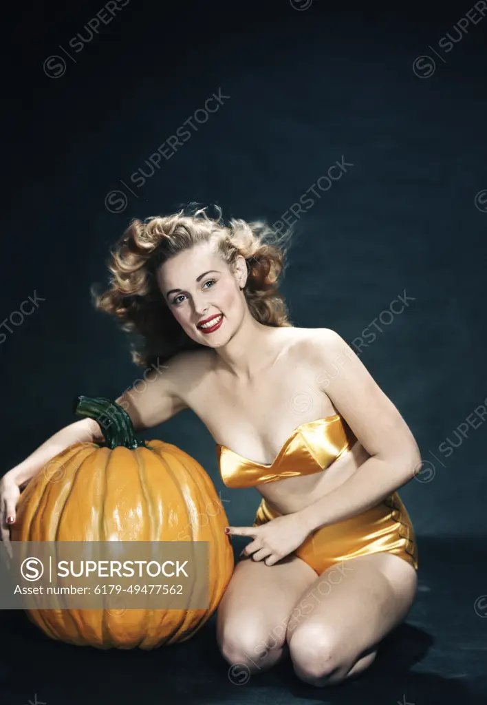 1950S Smiling Woman Pinup Wearing Two Piece Orange Bikini Posing