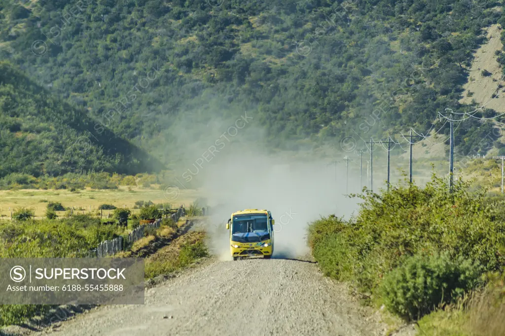 Tourist Bus at Austral Route, Patagonia, Chile AYSEN, CHILE, APRIL - 2017 - Tourist bus driving at gravel road at austral route in patagonia, chile Copyright: xZoonar.com/DanielxFerreira-LeitesxCiccarinox 11510697