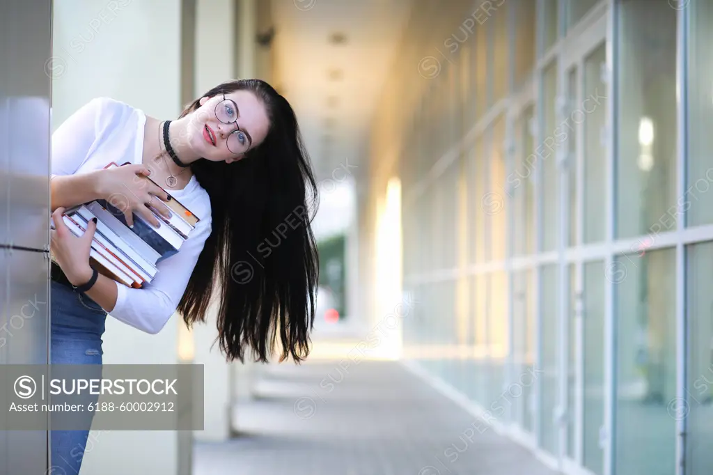 Girl student on the street with books Young girl student on the street with a backpack and books ,model released, Symbolfoto Copyright: xZoonar.com/AleksandrxKichiginx 12192839 ,model released, Symbolfoto ,property released