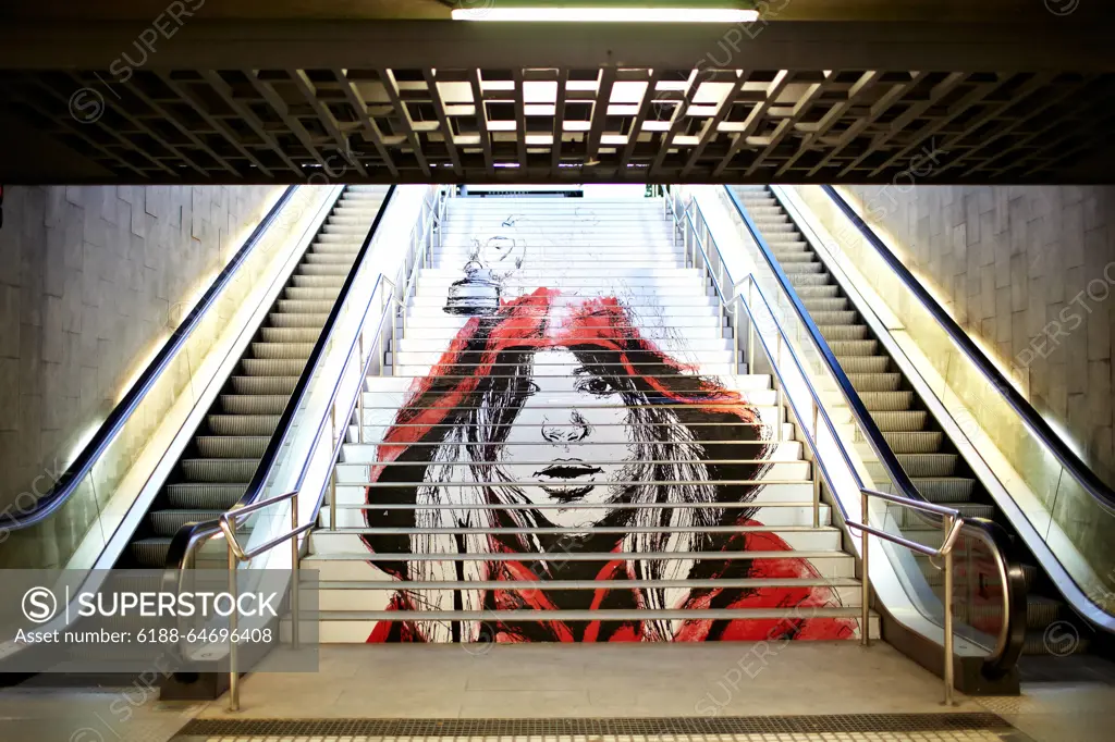 Graffiti in the metro. BARCELONA - MAY 23: Graffiti with the picture of a modern girl-teenager in a red loose overall on the steps of the Metro on May, 23, 2012 in Barcelona, Spain. ,model released, Symbolfoto ,property released Copyright: xZoonar.com/DanilxRoudenkox 3864045 ,model released, Symbolfoto ,property released