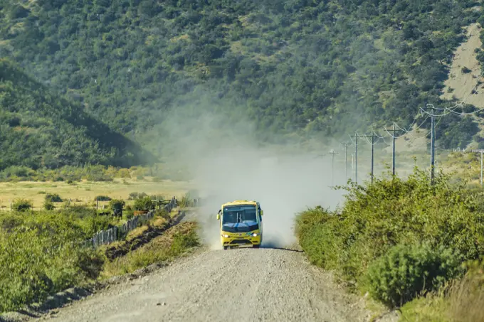 Tourist Bus at Austral Route, Patagonia, Chile AYSEN, CHILE, APRIL - 2017 - Tourist bus driving at gravel road at austral route in patagonia, chile Copyright: xZoonar.com/DanielxFerreira-LeitesxCiccarinox 11510697