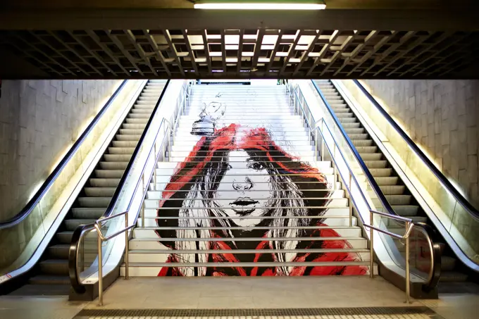 Graffiti in the metro. BARCELONA - MAY 23: Graffiti with the picture of a modern girl-teenager in a red loose overall on the steps of the Metro on May, 23, 2012 in Barcelona, Spain. ,model released, Symbolfoto ,property released Copyright: xZoonar.com/DanilxRoudenkox 3864045 ,model released, Symbolfoto ,property released