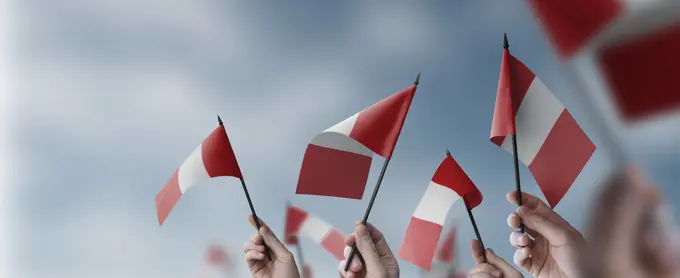 A group of people holding small flags of the Peru in their hands A group of people holding small flags of the Peru in their hands. Copyright: xZoonar.com/AlekseyxButenkovx 20098182