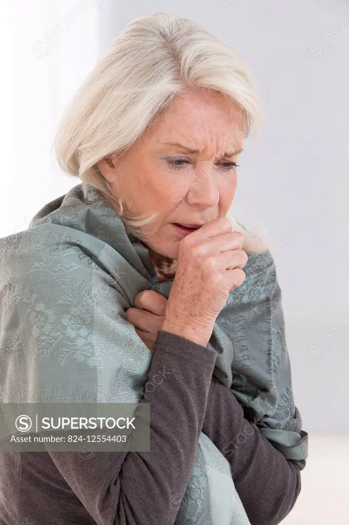 Senior woman coughing.