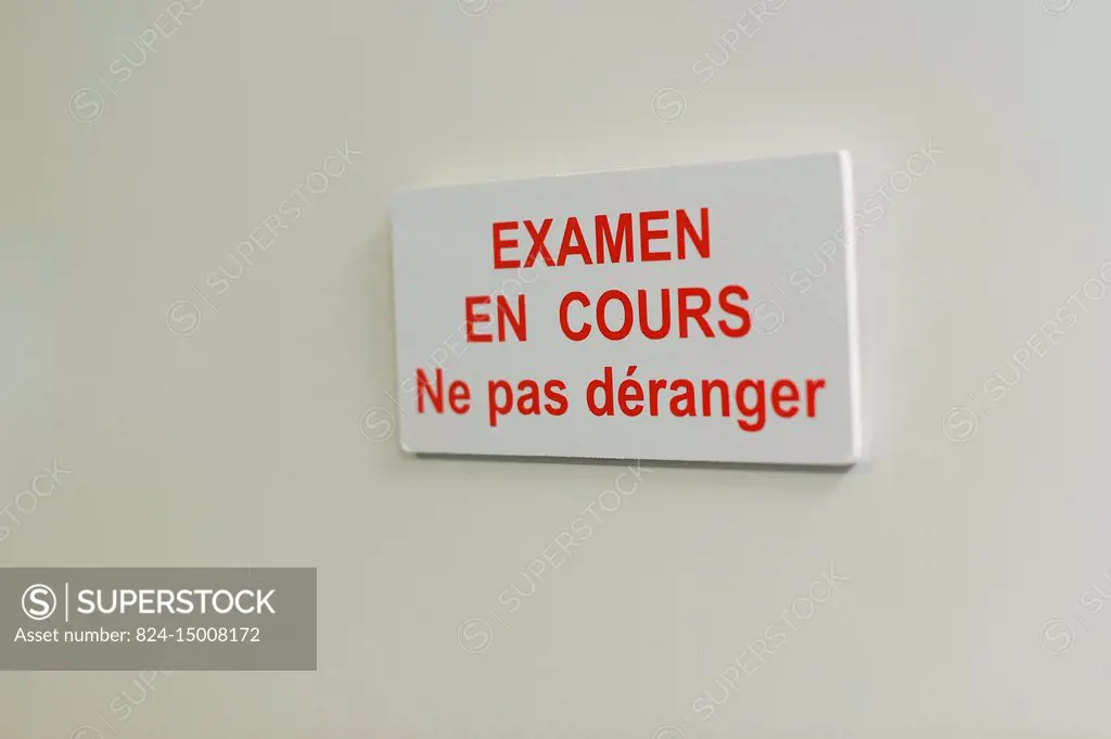 Reportage in the epileptology unit in Nice Hospital, France. A sign saying Exam in progress - do not disturb.