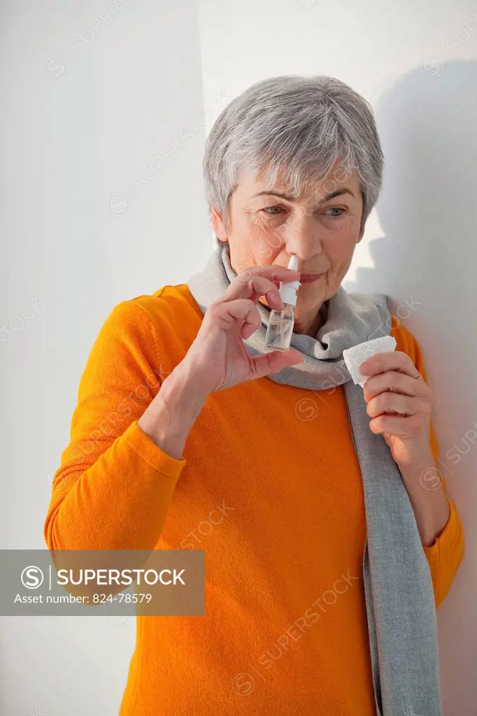 ELDERLY PERSON USING NOSE SPRAY