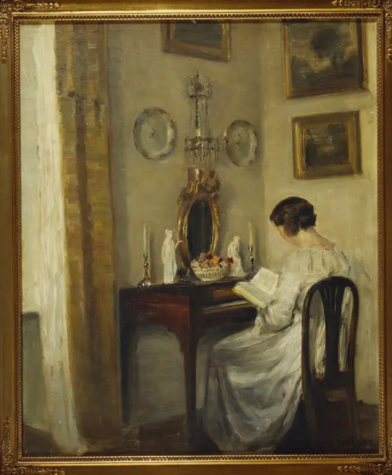 An Interior with a Girl Reading at a Desk. Carl Holsoe (1863-1935). Oil on canvas, 57.8 x 47.8cm.